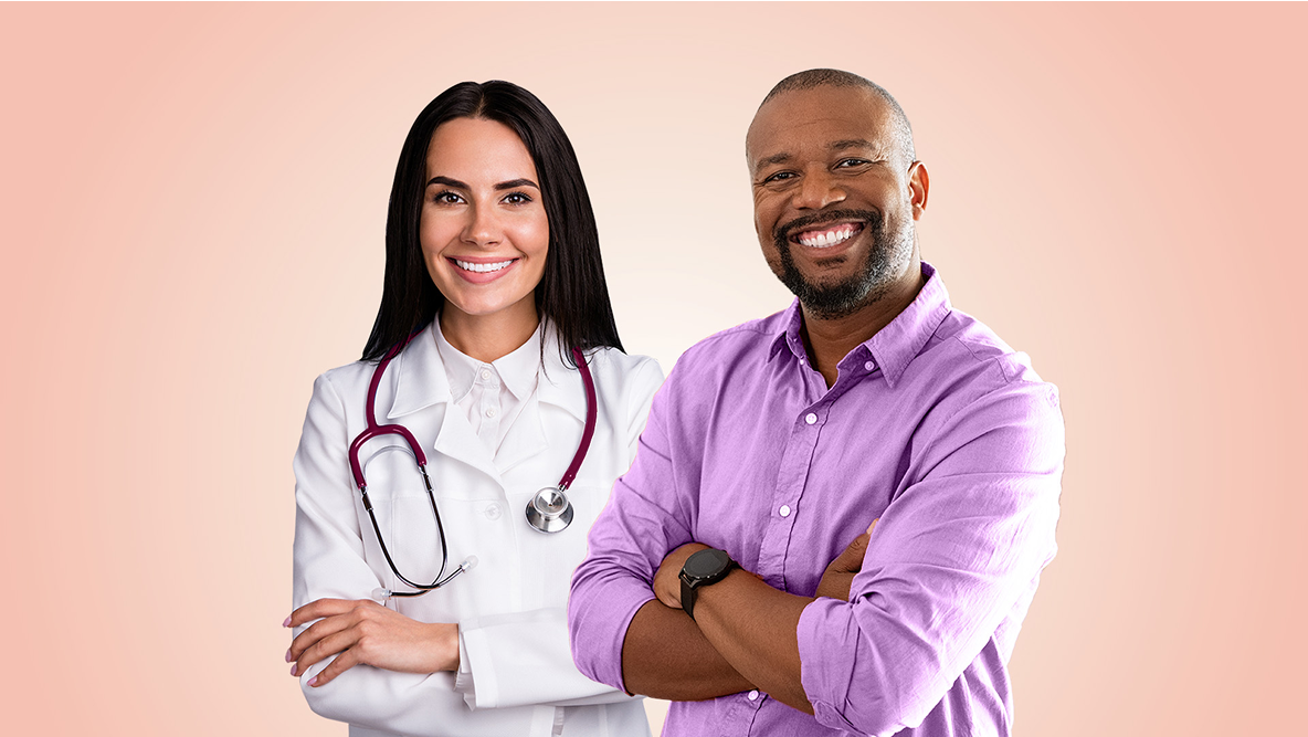 Male Doctor With Female Doctor Stand Together Smiling